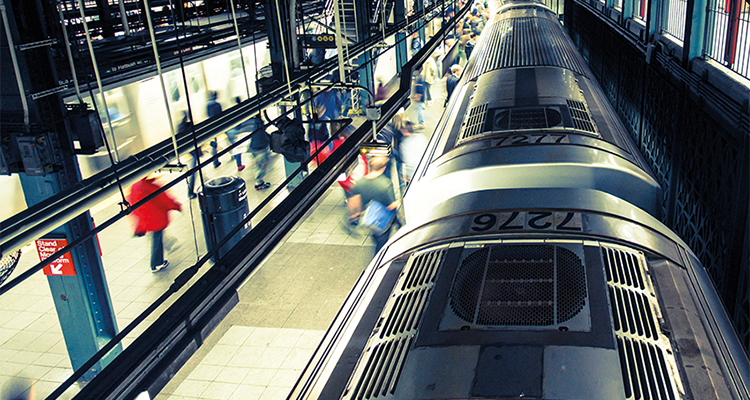 modern train station with blurred people suggesting motion