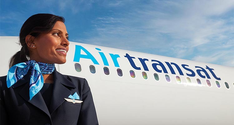 Stewardess in front of Air Transat plane