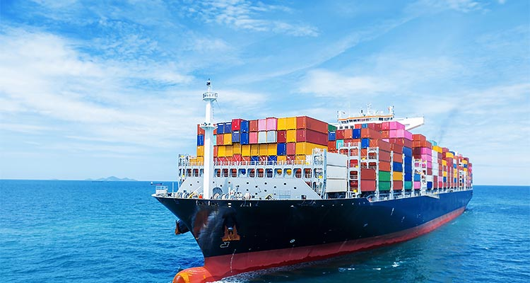 Fully laden container ship in calm blue seas