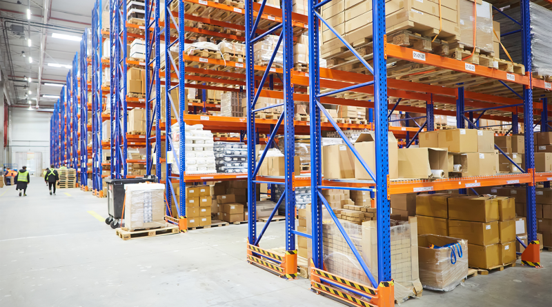 Lines of storage shelves with packages on in a warehouse to support Warehousing and Distribution article