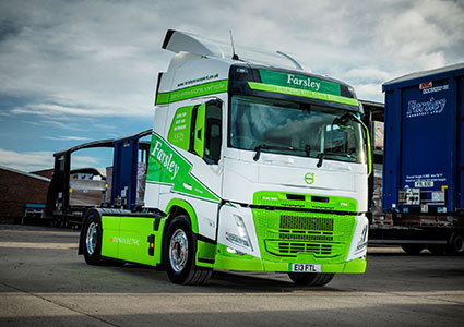 Green & white Farsley electric truck