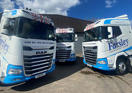 Three blue and white Farsley trucks