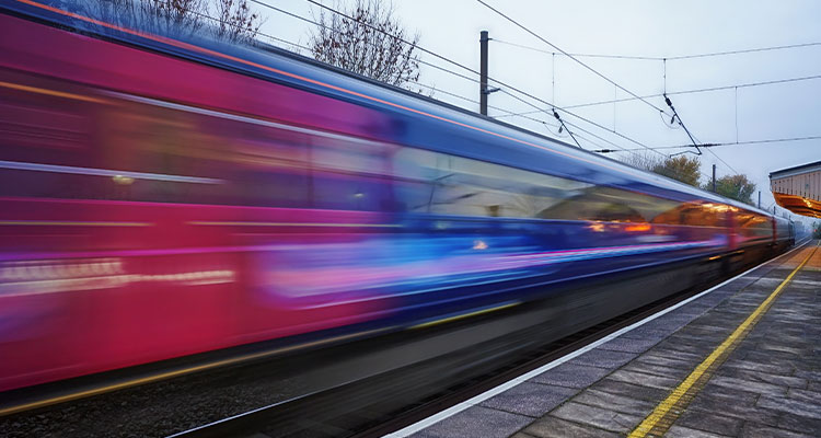 Train speeding through a station