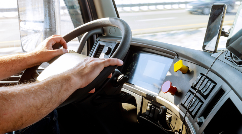 Person at steering wheel in truck to support American truckers article