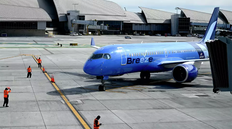 Blue Breeze Airways plane on airport runway