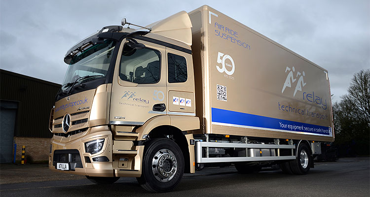 gold colored, 18-ton Mercedes-Benz truck symbolizing Relay Technical Transport 50th anniversary