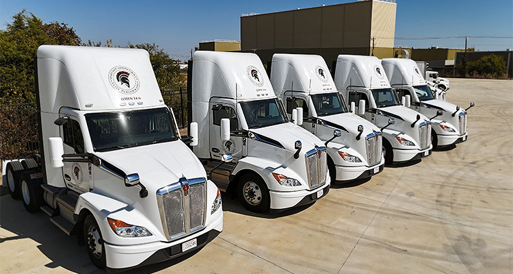 fleet of Spartan Carrier Group semi-trailer trucks