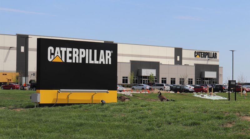 Caterpillar faces $1.5B tariff hit as profits decline Caterpillar factory floor with industrial machinery and assembly line equipment