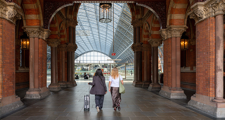 How London St. Pancras Highspeed manages critical infrastructure, enabling fast, low-carbon travel to Europe view inside St Pancras International Station in London, known for its distinctive Victorian Gothic architecture and impressive train shed.
