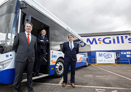 Sandy Easdale, James Easdale, and McGill's CEO Ralph Roberts celebrating the acquisition of First Bus's Scotland East business by the McGill's Bus Group