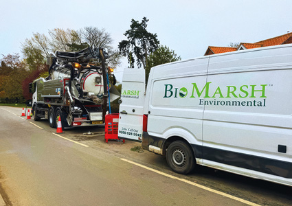 a BioMarsh Environmental specialist vehicle team working along a roadside