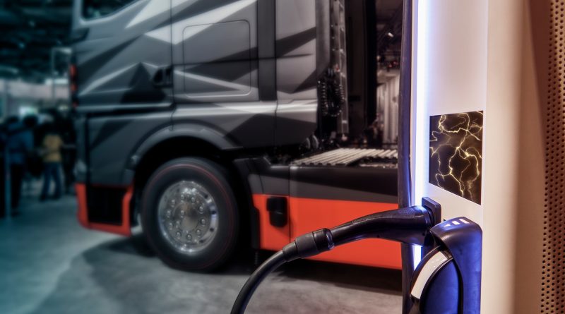 Electric commercial trucks charging at a California freight distribution facility