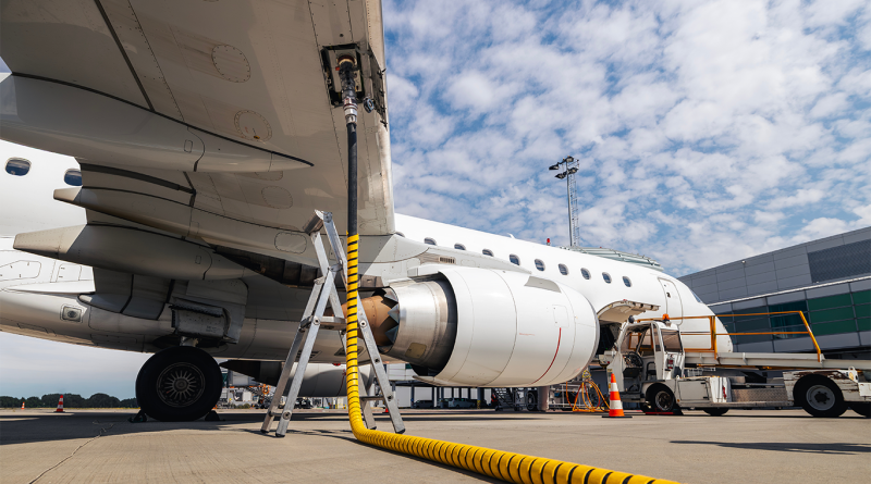 Refueling of airplane at airport. Ground service before flight.