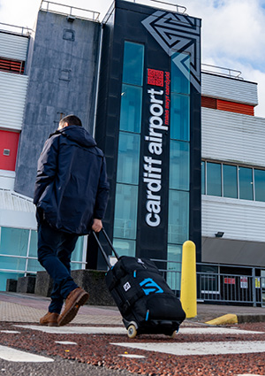 a traveler outside the main terminal at Cardiff Airport