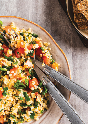 a traditional vegetarian tabbouleh salad served on a ceramic plate