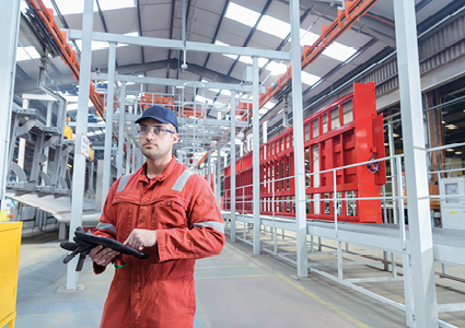 a worker inside the Montracon Ltd commercial trailer manufacturing facility
