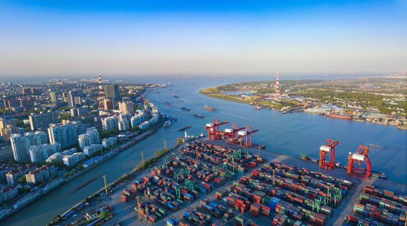 Container ships and cranes at a congested Asian container port